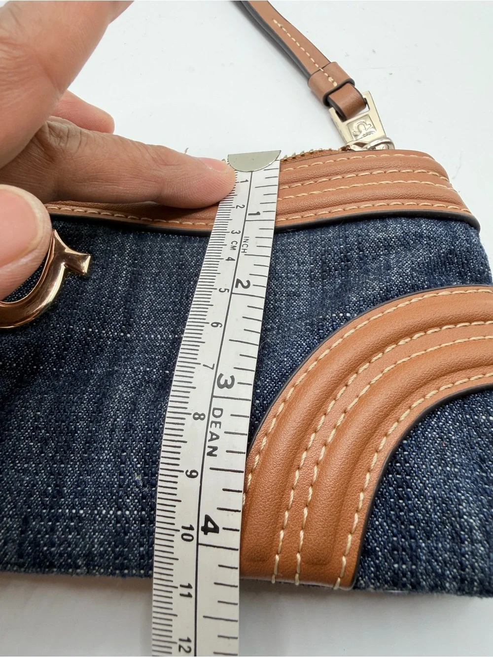 True Religion Denim Wristlet with Tan Trim and Gold Logo